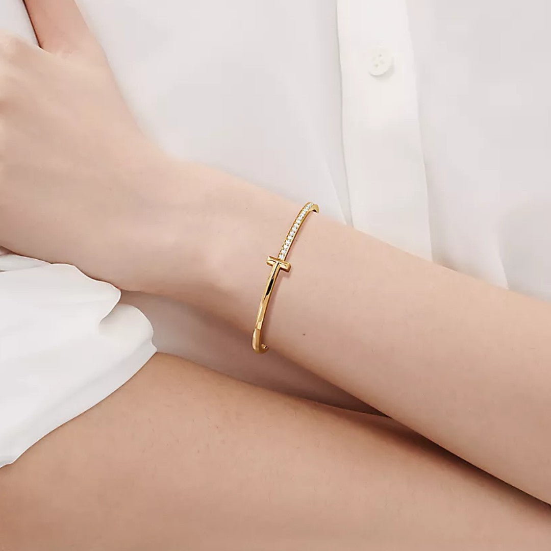 18k gold Tiffany & Co. with round brilliant diamonds T1 Narrow Diamond Hinged Bangle