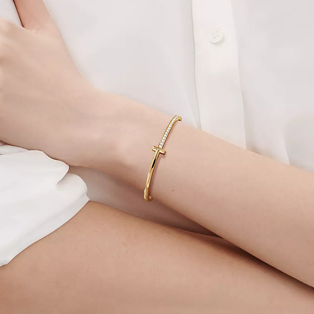 18k gold Tiffany & Co. with round brilliant diamonds T1 Narrow Diamond Hinged Bangle